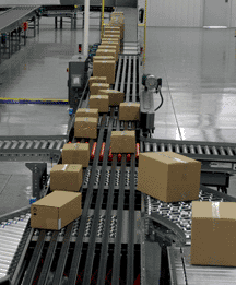Conveyor system moving boxes through a distribution center